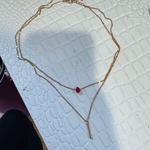 Elegant Gold Necklace with Red Pendant